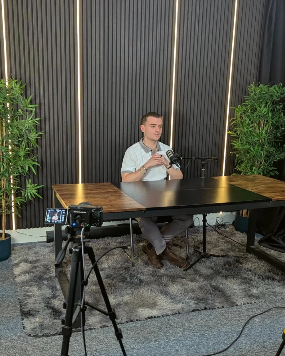 Lewis Ford at the mic in the studio where the weekly client videos are recorded